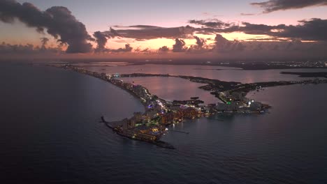 Aerial-view-around-the-hotel-zone-of-Cancun,-stunning-sunset-in-Quintana-roo,-Mexico---wide,-panoramic,-drone-shot