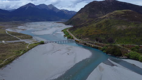 Drone-around-road-through-New-Zealand-Alps