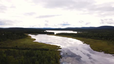 Overcasted-skies-lurking-over-Abisko-National-park-shores-Sweden-aerial