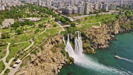 Antalya-Turkey-Aerial-v66-birds-eye-view-capturing-rocky-coastal-cliff-with-powerful-lower-düden-waterfall-pouring-into-the-sea-with-scenic-boats-cruise-in-summer---Shot-with-Mavic-3-Cine---July-2022