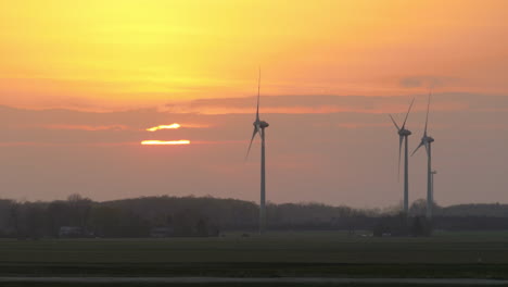 Wind-turbines-filmed-in-the-fields-at-sunset