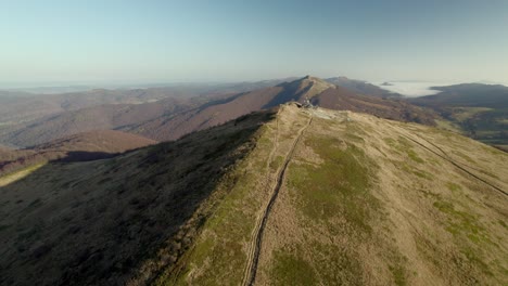 Drone-flying-towards-Tarnica-mountain-in-the-border-with-Pokand,-Slovakia-and-Ukraine