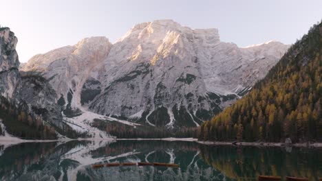 Drone-Descends-to-Reveal-Iconic-Row-Boats-on-Lago-di-Braies-in-Dolomite-Mountain-Range