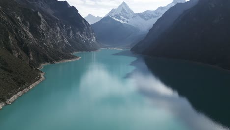 Aerial-Lake-Landscape-Turquoise-Blue-Water-Laguna-Paron-Peru-Snowy-Mountain-Peak-Andean-Peruvian-Cordillera,-Beautiful-Natural-Unpolluted-Trekking-Destination