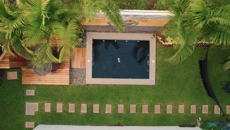 Drone-shot-of-swimming-pool-at-the-Casa-Malca-Hotel-beach-club-in-Tulum,-Mexico