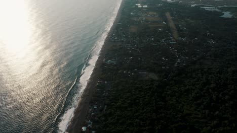 Birds-Eye-View-Of-Monterrico-Town-With-Idyllic-Beach-During-Sunrise-On-The-Pacific-Coast-Of-Guatemala