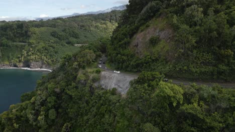 Aerial-View-Of-Cars-Driving-Along-Road-To-Hana-Along-Maui-Coastline