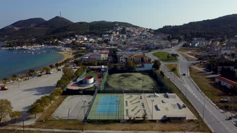 Aerial-establishing-over-small-town-with-outdoor-sports-facilities