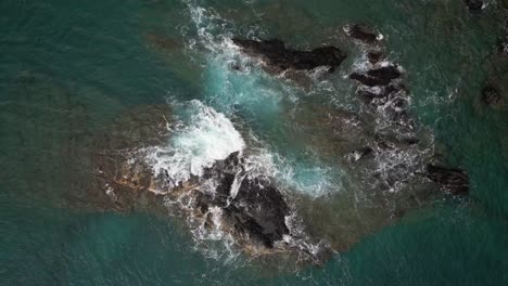 Aerial-Top-Down-Over-Waves-Crashing-Over-Rocks