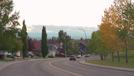 SUV-driving-down-road-in-quiet-neighbourhood-in-Canada