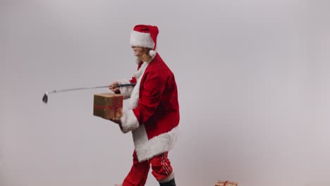 Wasted,-blindfolded-and-shirtless-Terrible-Santa-Jake-plays-golf-with-your-Christmas-presents