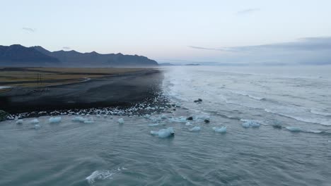 Aerial-forward-over-deserted-Diamond-beach-in-Iceland