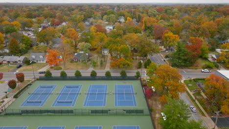 Push-over-tennis-courts-in-a-park-and-into-Kirkwood-neighborhood-in-the-Autumn-at-peak-color-on-a-pretty-day