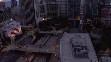 Drone-shot-of-cars-driving-on-Interstate-5-to-leave-Seattle's-downtown-district