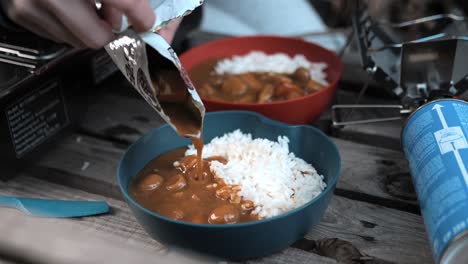 serving-curry-rice-in-the-Nature,-Outdoor,-Camping