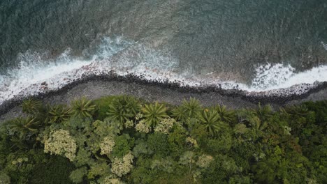 Aerial-Top-Down-Tracking-Shot-Along-Rocky-Coastline-With-Waves-Breaking-Off-Kalaloa-Point