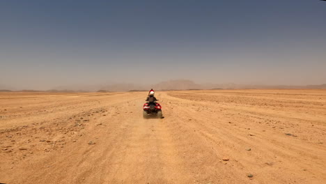 Quad-Bikes-Driving-at-Safari-Desert-in-Hurghada,-Egypt,-Off-Road-Trip,-Sandy-Terrain,-Horizon-View,-Extreme-Sports,-60-Fps