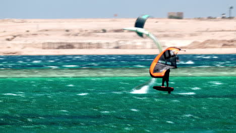 Windsurfing-in-Hurghada,-Egypt,-60-Fps-People-enjoy-Recreational-Water-Sea-Sport-in-Touristic-Destination