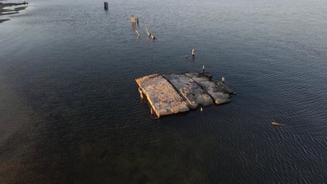 The-remnants-of-a-cement-dock-off-the-shore-of-Muskegon-Lake-in-evening