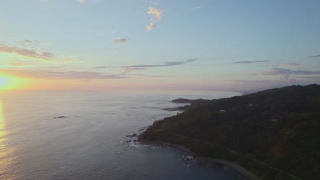 Incredible-drone-pan-from-rocky-uninhabited-coast-to-fantastic-evening-sunset