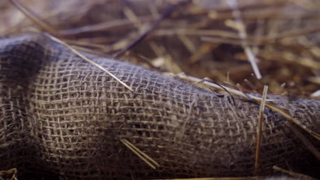 Macro-close-up-of-burlap-with-hay-and-straw
