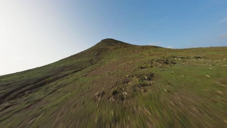 fuerteventura-fpv-green-mountain-rise-on-a-beautiful-sunny-day