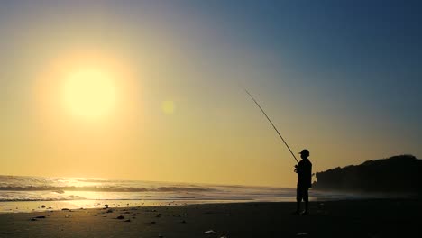 Fisherman-at-Beach-during-Sunset-Time-silhouette