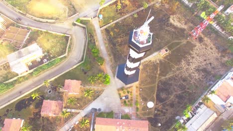 Drone-shot-looking-down-on-a-light-house-in-Pondichery,-India-with-panning-movement