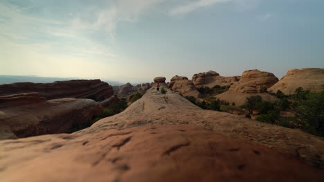 Man-jogging-on-rocks-in-Utah-desert-at-sunset-for-health-and-wellness