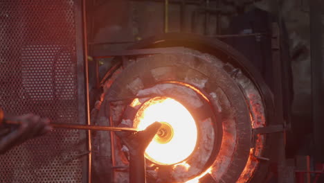 Hot-glass-being-molded-in-a-furnace-in-slow-motion