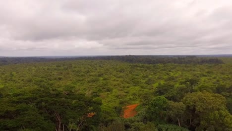 Aerial-drone-view-above-africanl-rainforest,-on-a-cloudy-day,-in-Nanga-Eboko-Forest,-Haute-Sanaga,-Southern-Cameroon