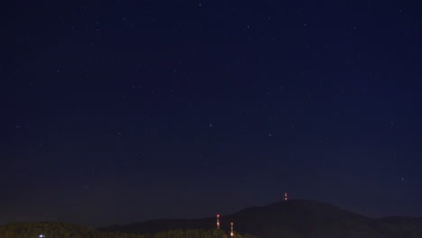 TIME-LAPSE:-STARS-MOVING-OVER-A-MOUNTAIN