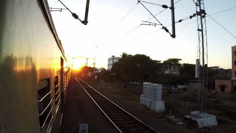 Train-Leaving-from-station-during-sunset-in-Chennai,-India