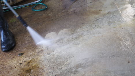 High-pressure-jet-washing-dirt-of-concrete-flooring