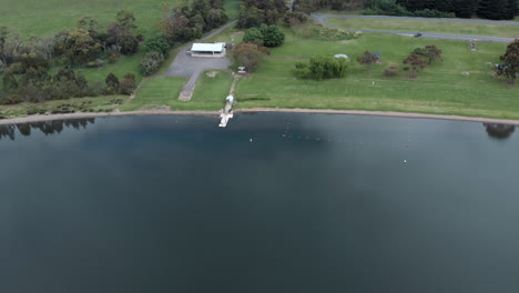 Aerial-view-over-large-lake-with-harbour-jetty---swimming-area