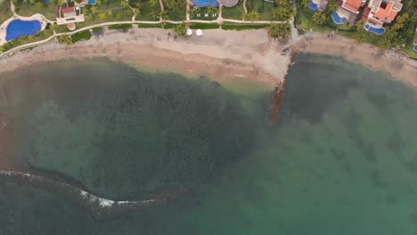 AERIAL:-Beach-from-above-with-waves-and-pools