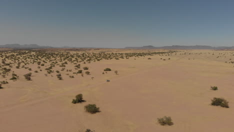 Car-driving-alone-in-the-distance-in-desert