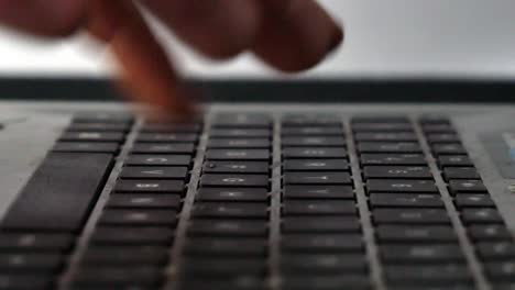 close-up-of-finger-typing-on-a-keyboard