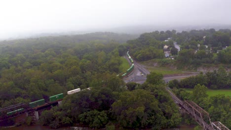 Aerial-Drone-Shot-of-Train-Crossing-Bridge-Over-River
