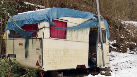 abandoned-caravan-in-the-forest-pull-away-shot