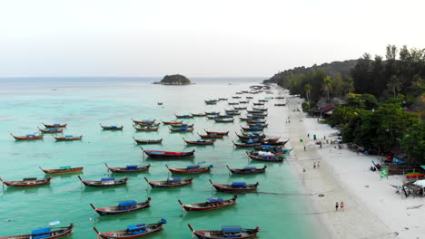 Fly-over-boats-anchored-on-a-clear-water-beach