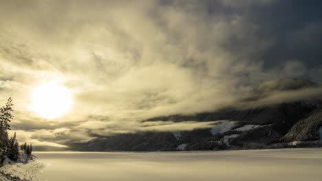Calm-after-a-Storm-With-Active-Clouds-and-Sunrise-on-a-Frozen-Lake-Timelapse