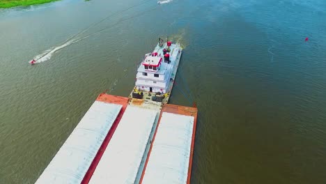 Aerial-view-of-a-barge-moving-freight-up-the-Mississippi-River