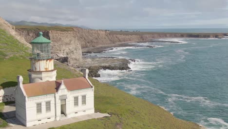 Historic-lighthouse-along-coastal-cliff-side-