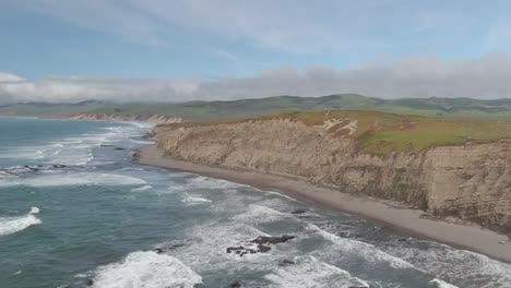 Ocean-flying-to-California-coastal-cliffs-