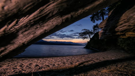 Timelapse-of-Sunset-Under-Moving-Beach-Logs