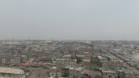Aerial-shot-of-Jakande-slum-in-Lekki,-Lagos,-Nigeria,-Africa