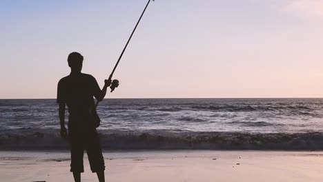 High-Quality-Silhouette-Man-with-Fishing-Rod-at-Bali-Beach-when-Sunset-time-Free-Space-Background-Sunset-Sky