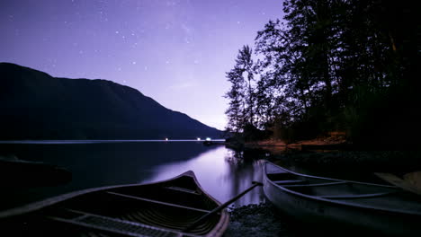 Starlapse-of-Canoes-on-a-Calm-Lake-with-Mountains-and-Trees