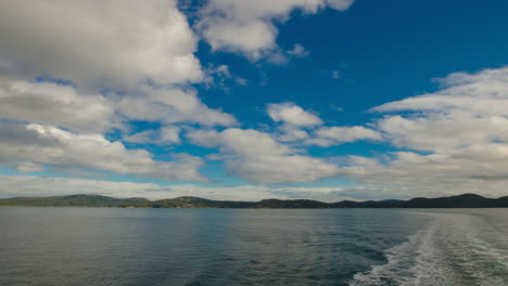 Timelapse-Hyperlapse-Off-of-Back-of-Ferry-with-Lots-of-Moving-Islands-and-Clouds
